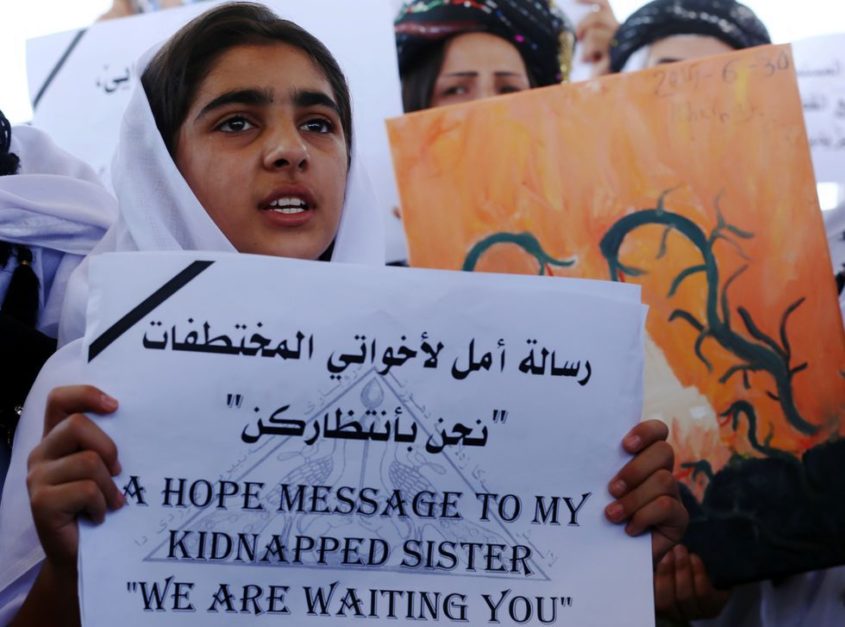 Yazidi-women-with-signs