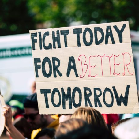 A poster in a protest that says 'Fight Today For A Better Tomorrow'