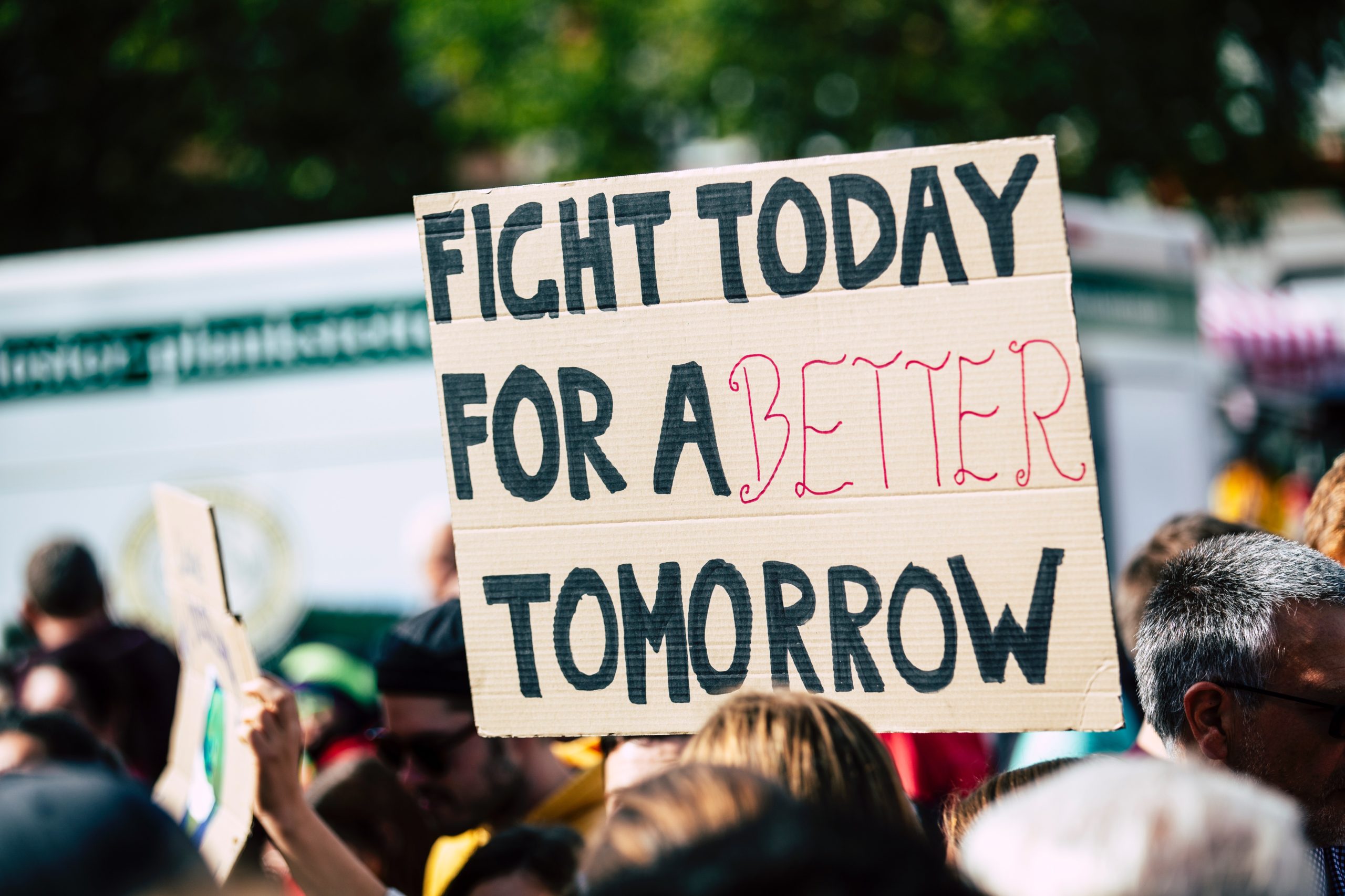 A poster in a protest that says 'Fight Today For A Better Tomorrow'