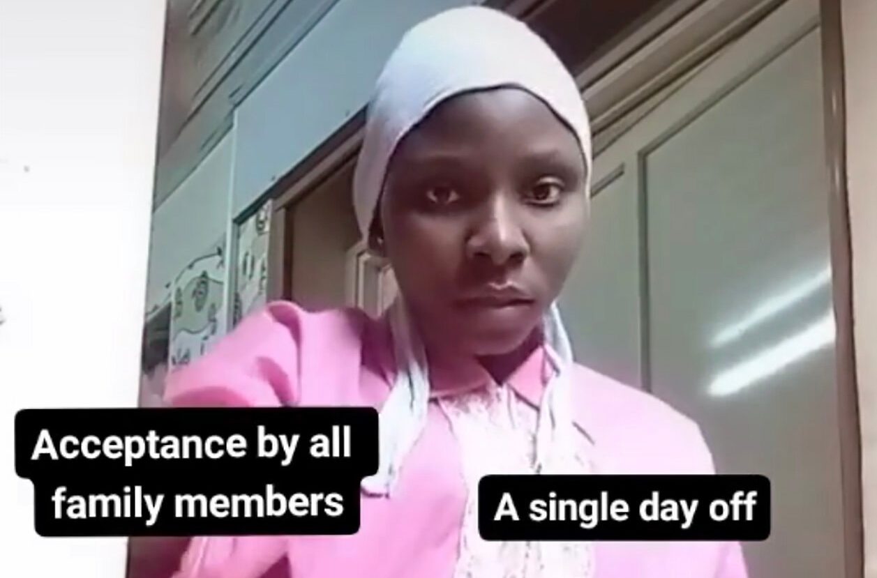 Woman wearing a scarf and along pink shirt with the words "Acceptance by all family members" and "A single day off" over her body