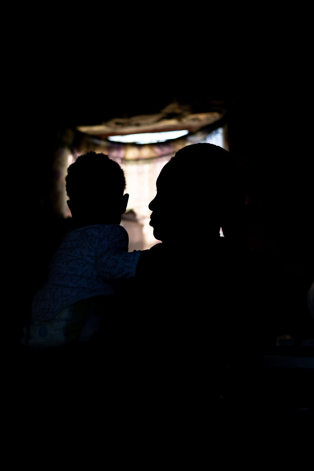 A photo of a woman and baby's sillouhette
