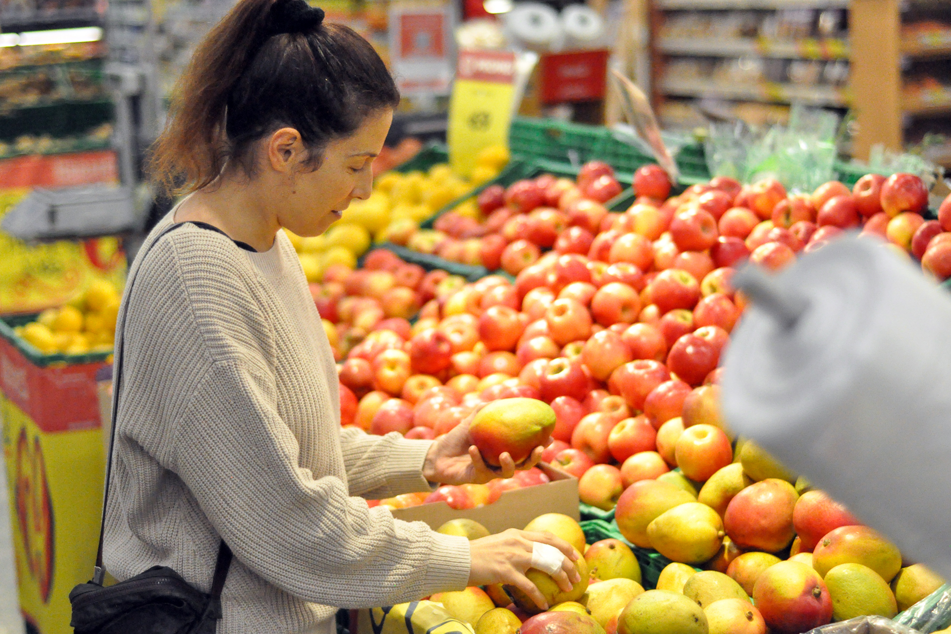 A woman shopping for produce