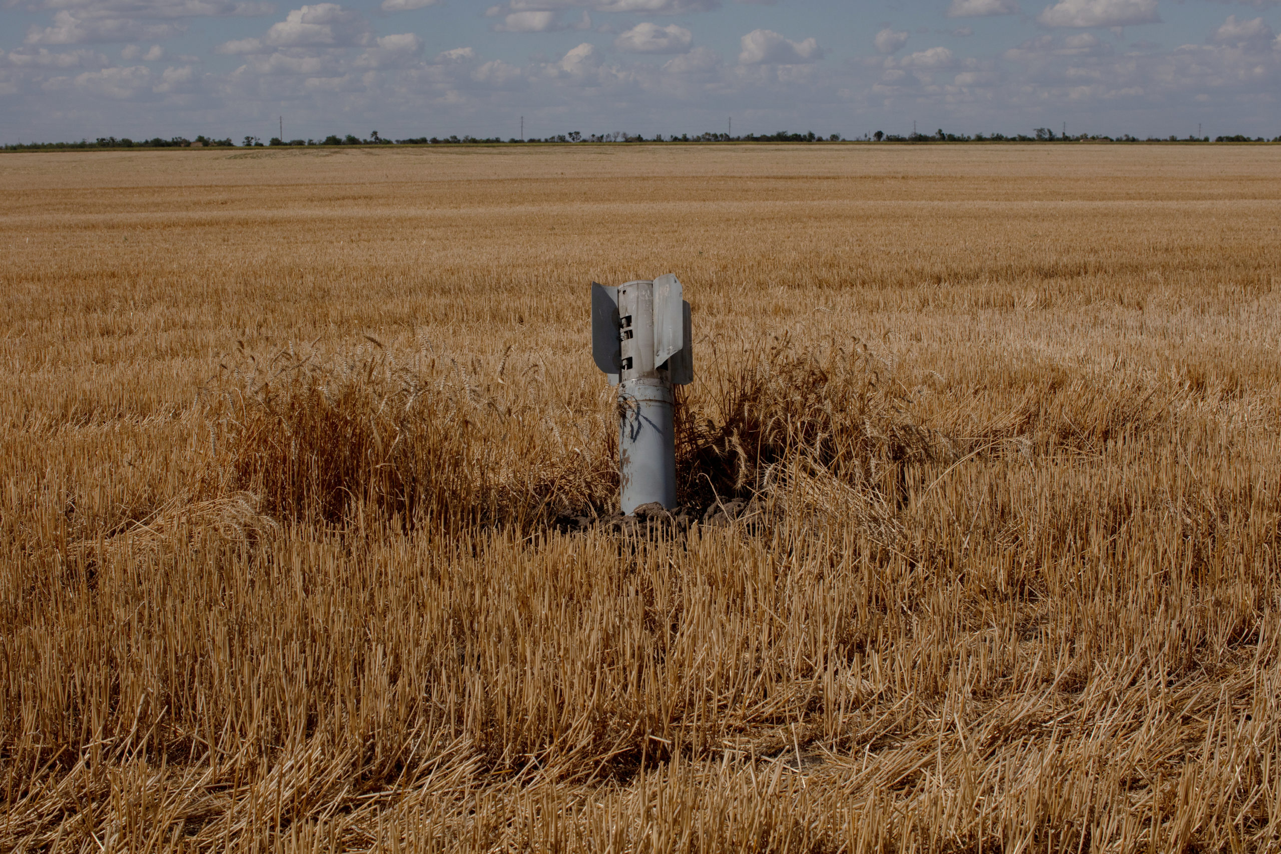 A missile shell lodged into a field