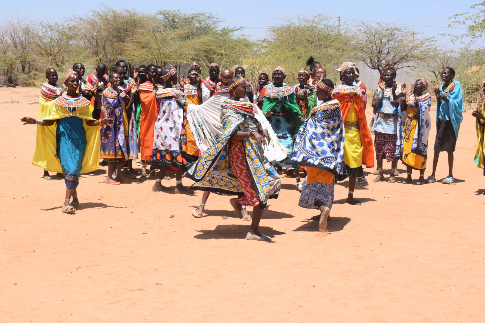 Women dance together at the Umoja Village women's refuge in northern Kenya.