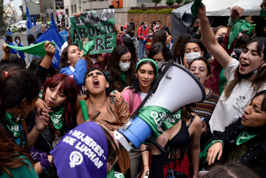 Protestors stand outside celebrating the decriminalization of abortion in Colombia.