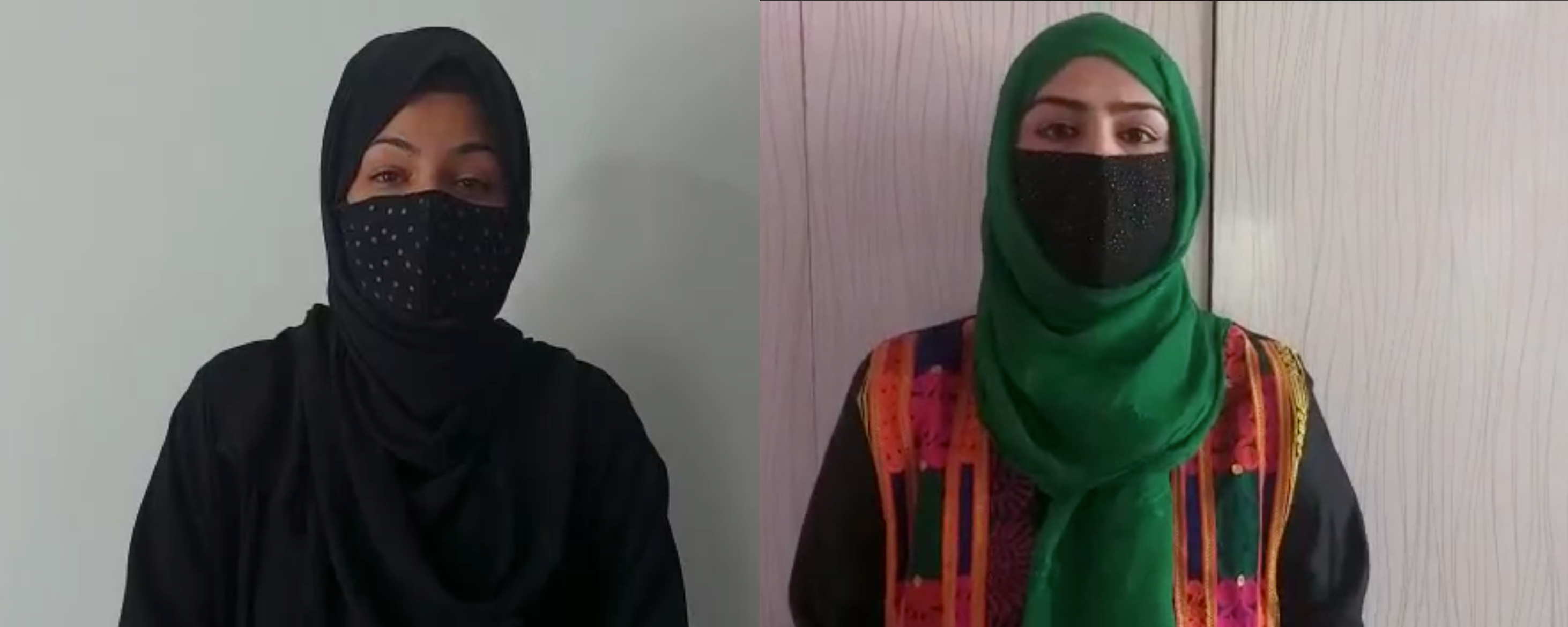 Two Afghan women stand with burqas on.