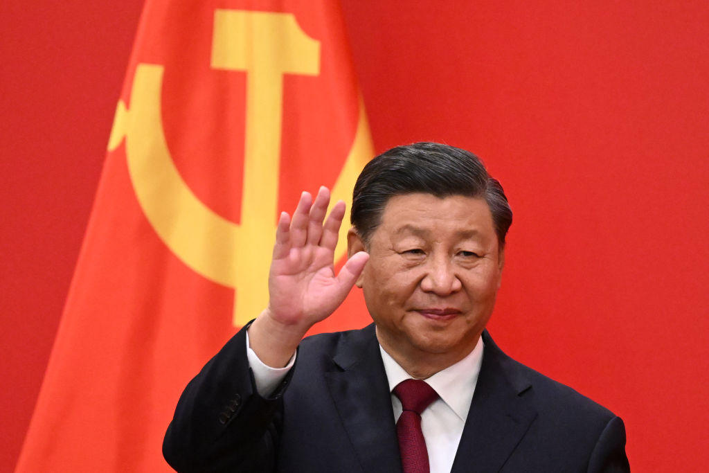 China's President Xi Jinping waves to members of Congress.