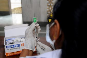 COVID-19 crisis in India A health worker prepares a dose of the COVID-19 vaccine at a Delhi government school in New Delhi, India on May 16, 2021. (Photo by Imtiyaz Khan/Anadolu Agency via Getty Images)